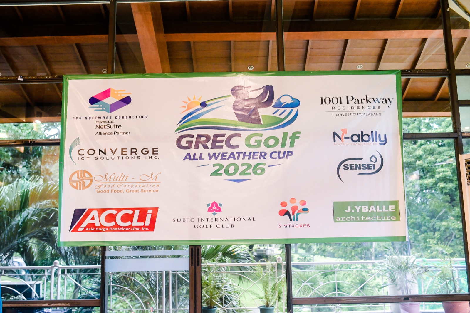 GREC Golf All Weather Cup 2026 sponsor banner listing all tournament sponsors