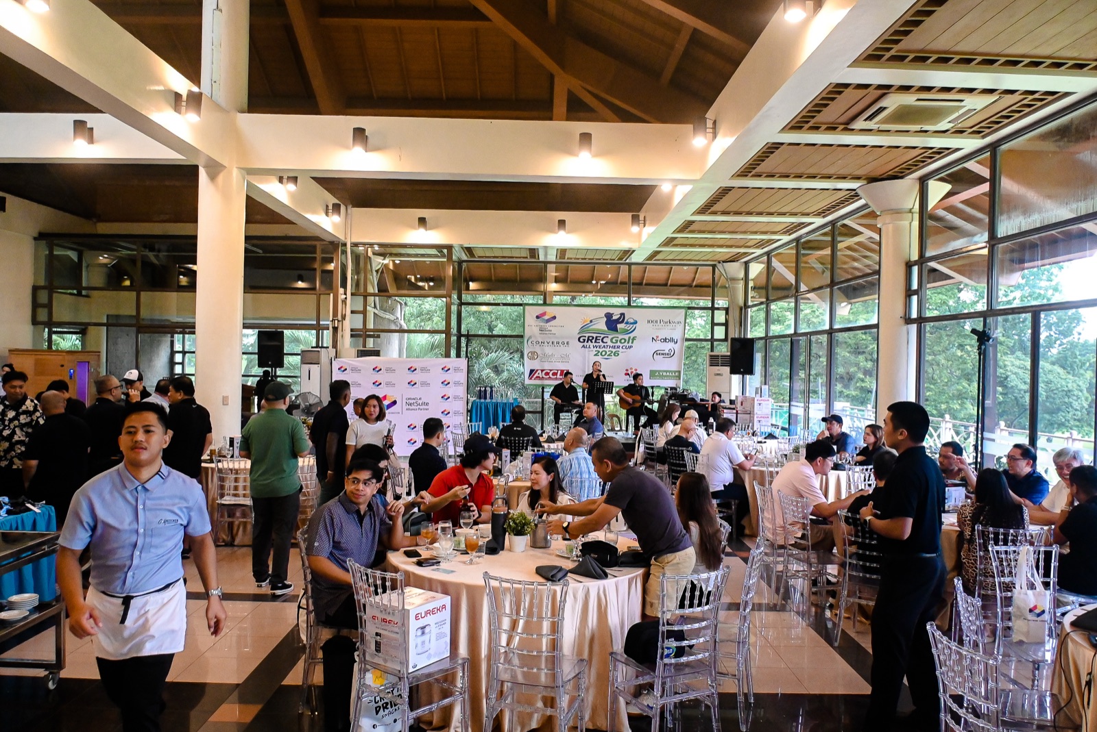Guests at the GREC Golf All Weather Cup 2026 awards night reception with live band