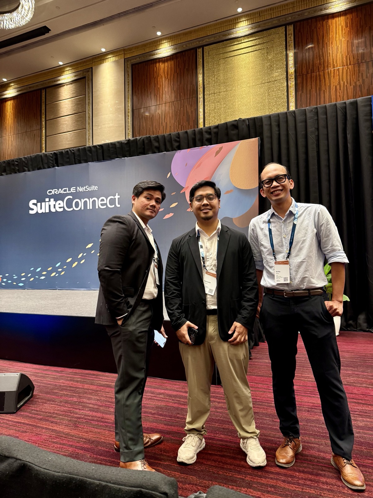 AVC team by the SuiteConnect stage banner